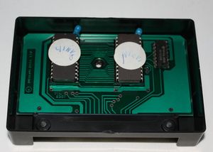 Open Cosmic Invaders cartridge exposing the electronics